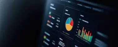 Digital dashboard screen displaying colorful pie charts and bar graphs for data analytics.