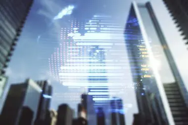 A digital world map overlay with code snippets is superimposed over a blurred city skyline of skyscrapers.