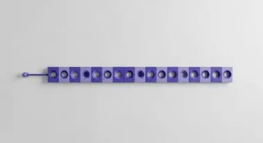 A row of purple cubes with circular cutouts represents data segmentation for tokenization.